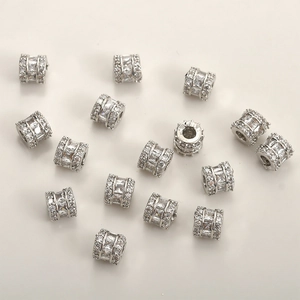 Macro shot of silver cylinder spacer beads with cubic zirconia for DIY jewelry making