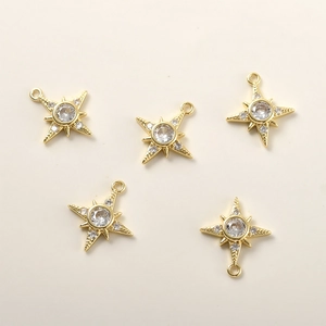 Detailed view of 14k gold-plated star pendants with zircon inlay for DIY jewelry making