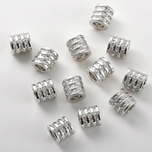 Macro di perline distanziatrici a botte in argento con zirconi cubici micro-pave