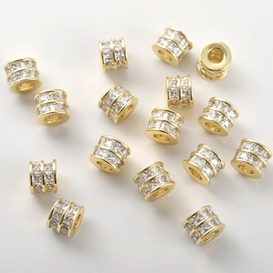 Macro view of 14k gold plated spacer beads with sparkling princess cut cubic zirconia