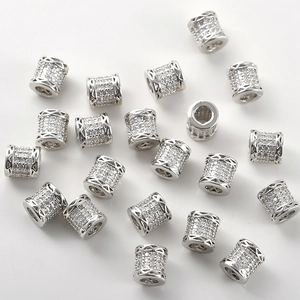 Detailed macro of 14k gold plated cylinder beads with micro-pave cubic zirconia