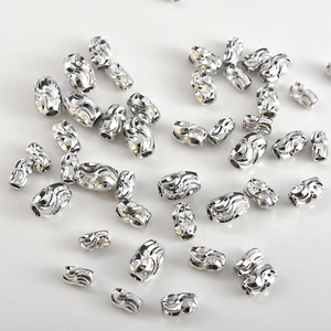 Macro view of wave-textured S925 sterling silver spacer beads for DIY jewelry making
