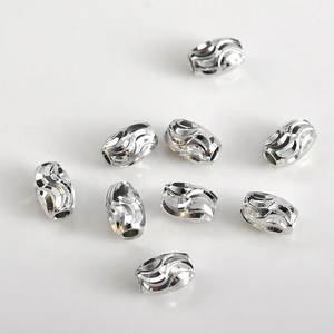 14k gold plated textured metal spacer beads in olive barrel shape for DIY jewelry making