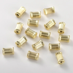 Detailed view of 14k gold-plated fluted cylinder spacer beads for DIY jewelry making
