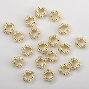 Detail of 14k gold plated heart flower spacer beads with micro-set zircon for DIY jewelry