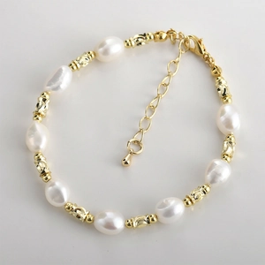 Baroque pearl bracelet with 14k gold plated textured cylinder spacers and lobster clasp