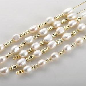14k gold plated cylindrical beads with screw motif on freshwater pearl strands