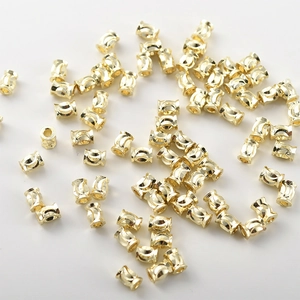 Detailed view of 14k gold-plated cylinder spacer beads for handmade jewelry DIY
