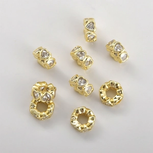 Detailed view of 14k gold plated heart bead with cubic zirconia for jewelry making