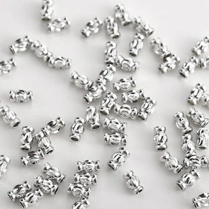 Macro shot of 14k gold plated textured cylindrical spacer beads for DIY jewelry making