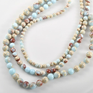 Natural sea sediment jasper round beads in light blue with brown mineral textures