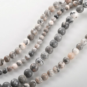 Macro shot of natural grey marble map jasper round beads in four different size options