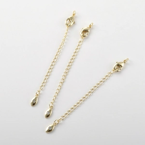 Tre catenine di estensione placcate in oro 14k con chiusura a moschettone e zirconi
