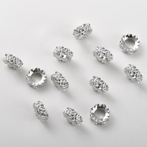 Macro view of four-leaf clover rondelle beads with micro-pave cubic zirconia crystals