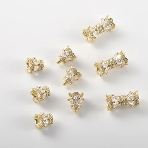 Macro detail of 14k gold plated crown screw clasps with zircon pave for DIY jewelry