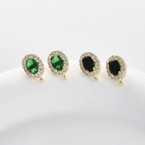 Oval emerald and black diamond style ear stud components with gold plated zirconia halo