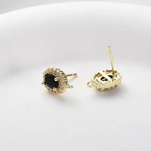 Detail of 14k gold plated oval black stone earrings with micro-set zircon and DIY loops