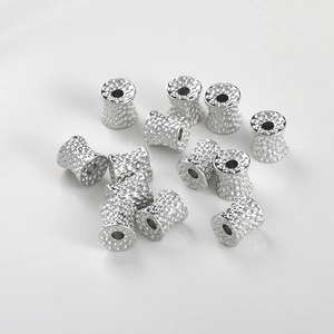 Detailed view of silver hammered metal tube beads for DIY bracelet and necklace jewelry
