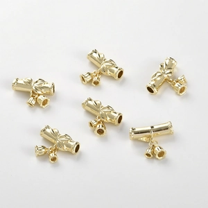 Detailed view of 14k gold plated bamboo tube charms with tiny flower bud pendants for DIY