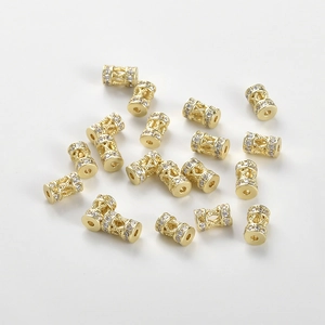 Macro shot of 14k gold plated wheel spacer beads with micro-set cubic zirconia stones