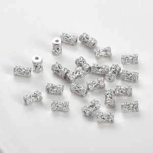 Macro shot of silver-colored wheel spacers with micro-pave cubic zirconia on white background