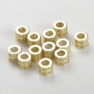 Close-up of 14k gold plated spacer beads with micro-set cubic zirconia for DIY jewelry