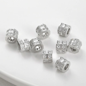 Macro shot of silver-plated hexagonal spacer beads with micro-pave cubic zirconia crystals