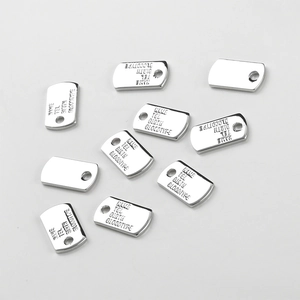 Detailed view of rectangular stainless steel ID tags with custom text engraving fields