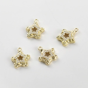Detail of 14k gold-plated star pendant with hammered texture and cubic zirconia inlay
