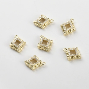 Macro view of 14k gold plated square pendant charms with zircon inlay for jewelry making