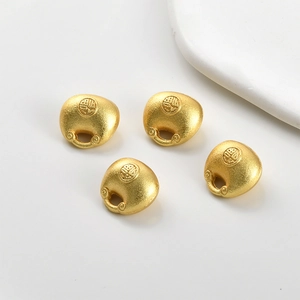 Set of four gold-plated hollow lucky bag pendants with sand gold matte finish and Fu character