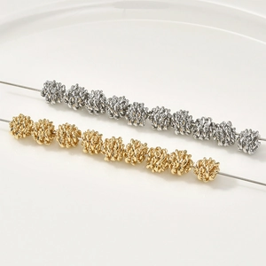 Macro view of twisted wire 14k gold plated round spacer beads for jewelry DIY