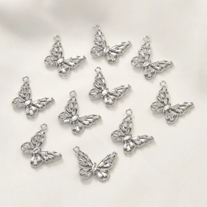 Set of 10 silver-plated hollow butterfly pendants with white zircon stones for jewelry making