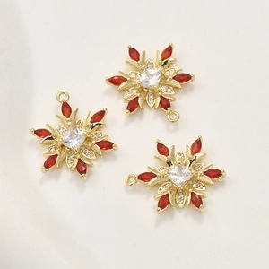 Set of three snowflake charms with 14k gold plating and red marquise zircon stones