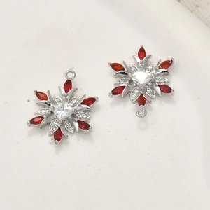 Detail of snowflake charms with red marquise gems and white cubic zirconia accents