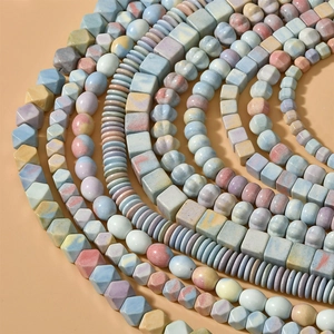 Macro detail of natural rainbow stone beads in geometric shapes for DIY jewelry making