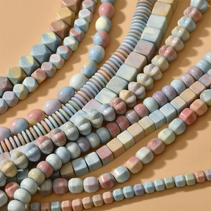 Macro shot of assorted colorful natural stone beads in round and geometric shapes
