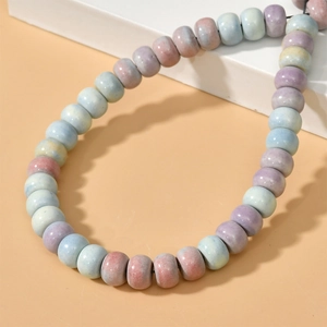 Macro detail of rainbow stone pumpkin beads for DIY handmade jewelry bracelets