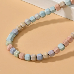 Macro shot of matte multi-color faceted cube beads for DIY necklace and bracelet crafting