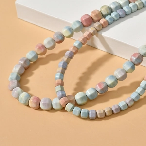 Macro view of natural rainbow stone square beads on necklaces with matte textures