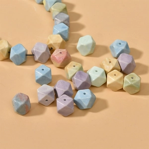 Macro shot of colorful geometric stone beads with marble texture for jewelry DIY