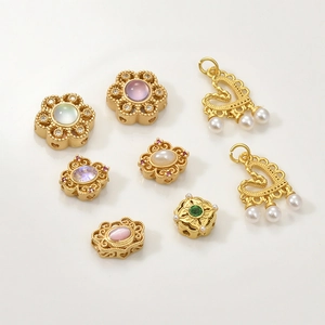 Vintage gold-plated floral and heart charms with pearls and gemstones for DIY jewelry