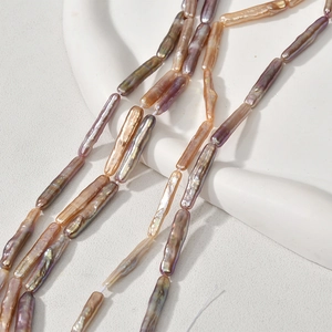 Macro view of long stick baroque pearls with metallic luster for jewelry making