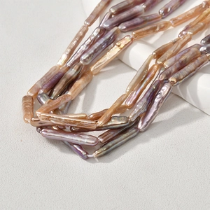 Natural baroque tooth-pick stick pearls with metallic luster in purple and champagne tones