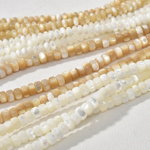 Close-up of 3-5mm natural mother of pearl beads with iridescent luster for DIY jewelry