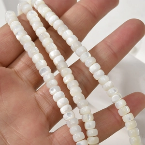 Macro shot of 3x5mm natural white mother of pearl shell beads for DIY jewelry making
