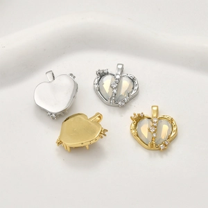 Macro detail of 18k gold and silver heart pendants with cubic zirconia for DIY necklaces
