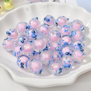 Bunte Acrylperlen mit blauen Cartoon-Gesichtern für DIY-Schmuckherstellung und Design