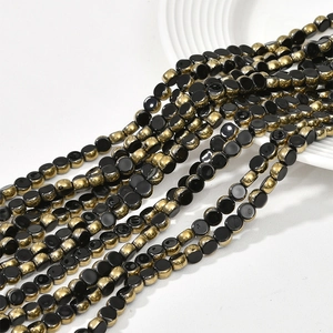 Close-up of 6mm flat round crystal glass beads with gold plating for DIY jewelry making