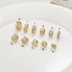 Macro view of 14k gold-plated spacer beads with cubic zirconia for DIY jewelry making